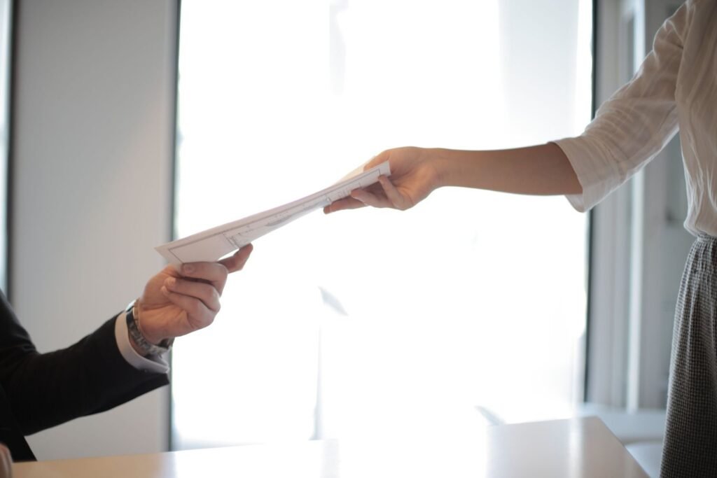 Handing over a CV for freshers applying for a first job