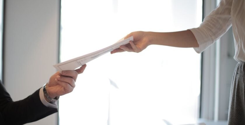 Handing over a CV for freshers applying for a first job