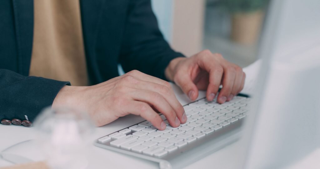 Data entry jobs in Pakistan: person typing on a laptop keyboard
