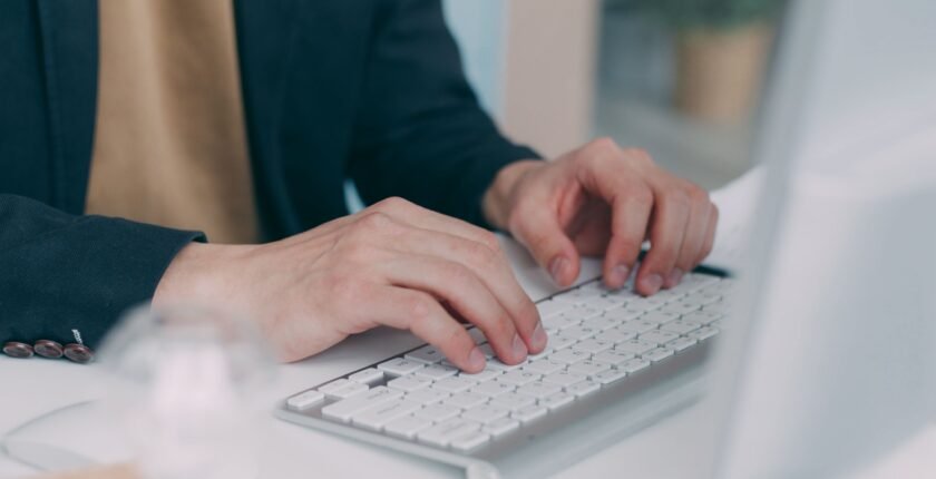 Data entry jobs in Pakistan: person typing on a laptop keyboard