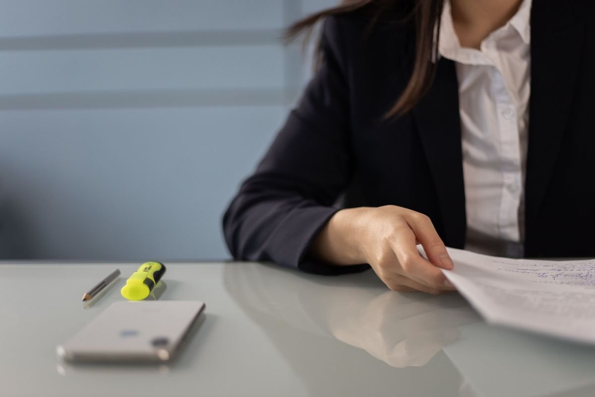 Woman reading documents carefully